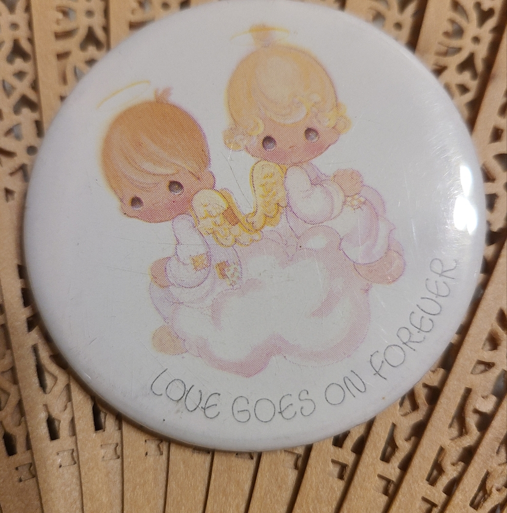 BUTTON Love goes on forever